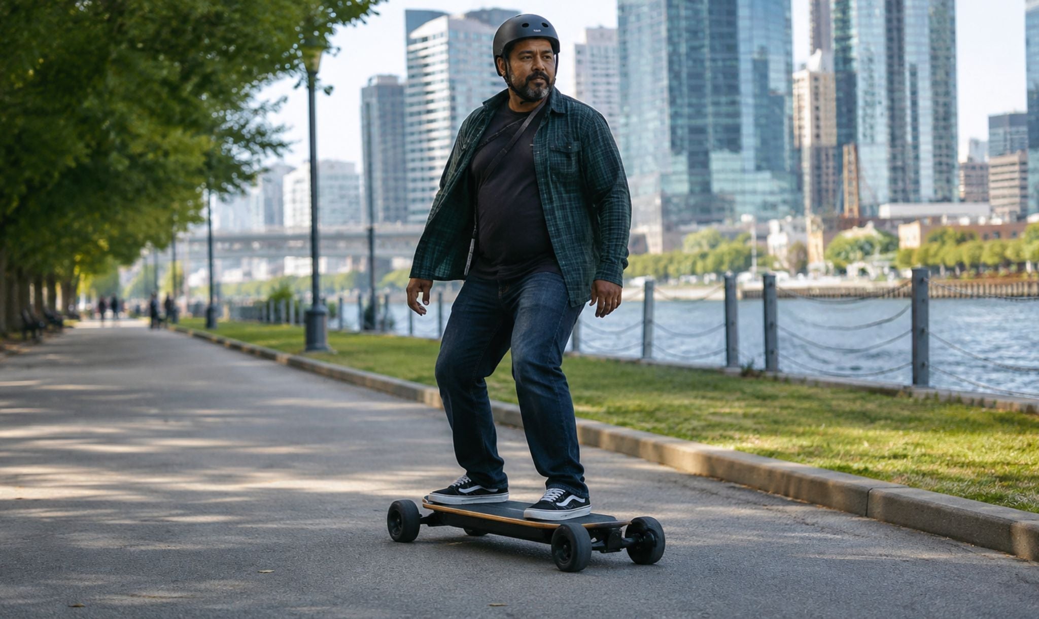 Heavy rider cruising on a stable wide electric skateboard.
