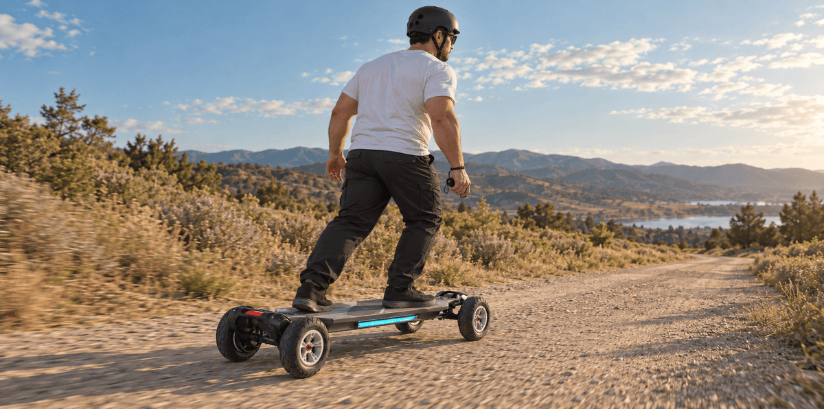 Helmeted rider on a Maxfind Cyber Ultra belt-drive skateboard with 175mm pneumatic tires along a dry packed-gravel path.
