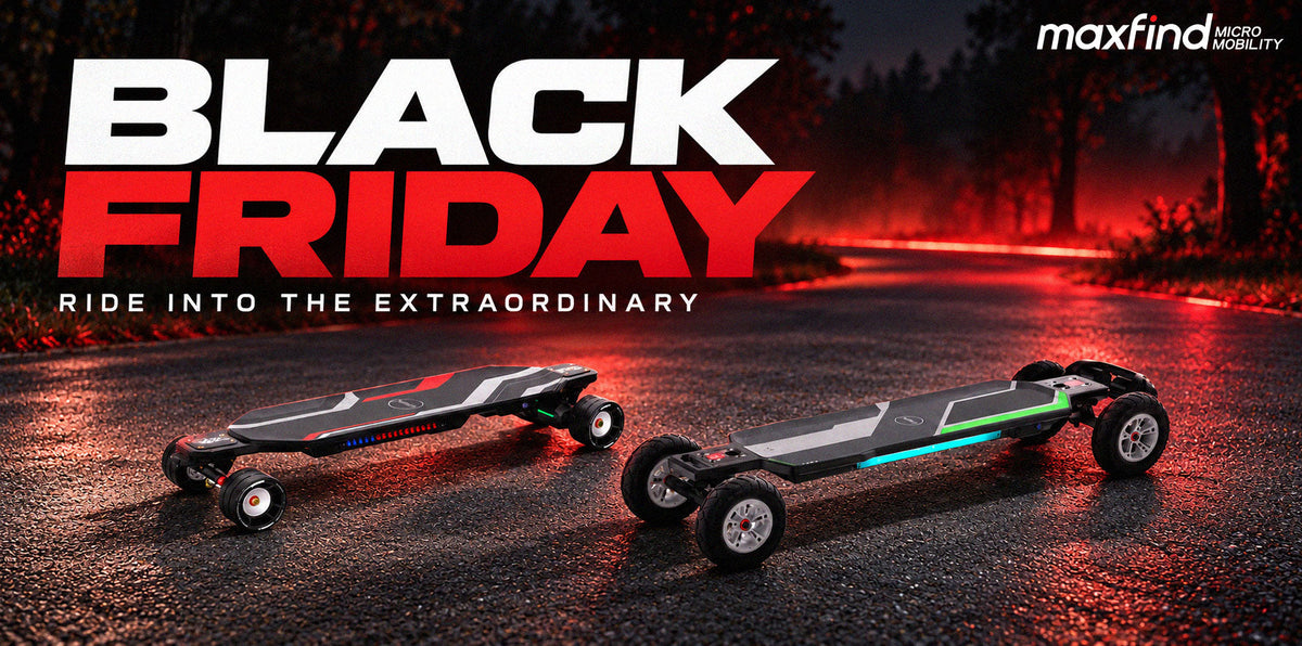 Black friday Maxfind Cyber Max X with 107mm wheels beside a belt-drive Cyber Ultra with 175mm pneumatic tires at a paved trail entrance.